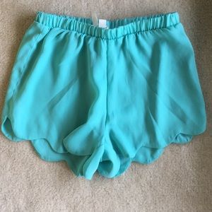 Green scalloped flowy shorts
